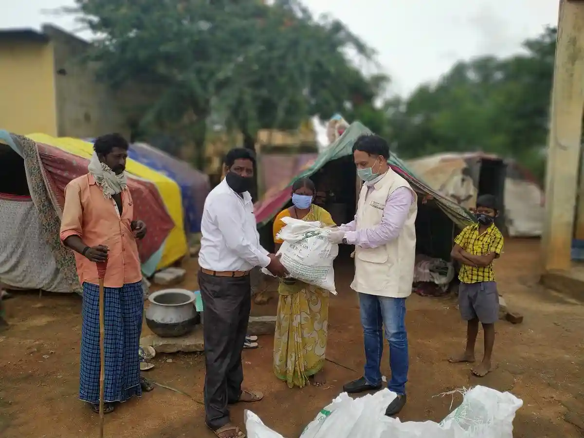 Trust volunteers distributing free ration to families in need