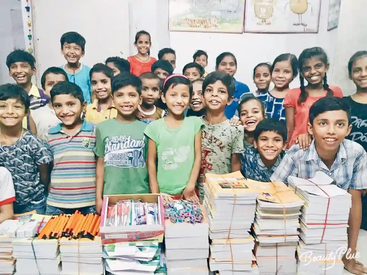 Schoolchildren receiving free books and stationery