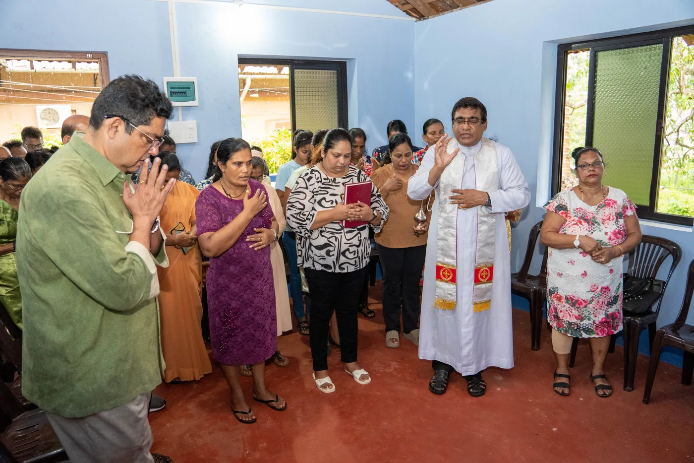Beneficiary family at their restored residence