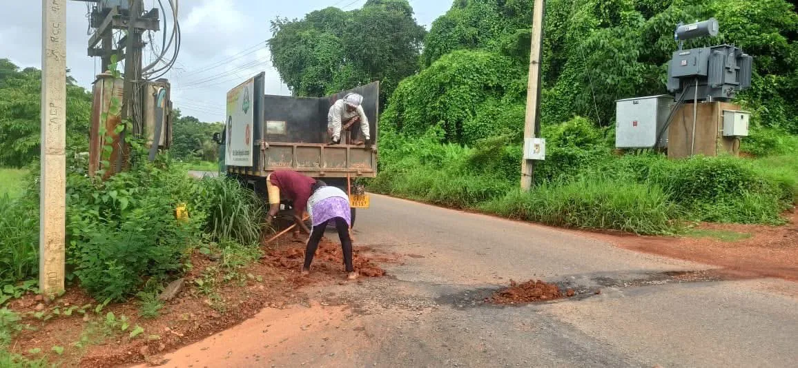 Trust team filling road potholes and clearing roadside shoulders